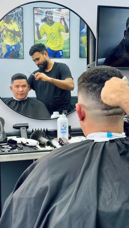 Mirror view of a haircut in progress
