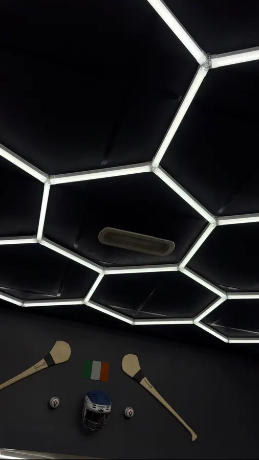 Hexagon ceiling lights and wall display inside the shop