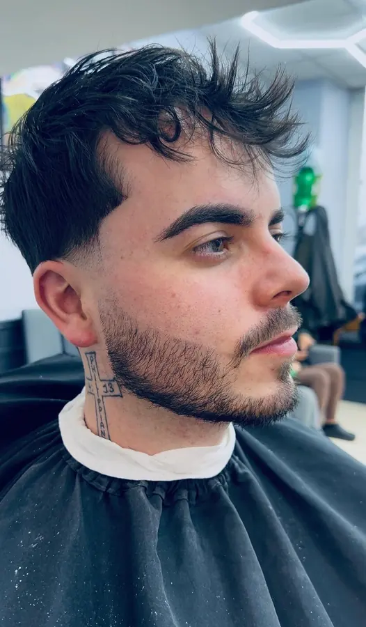 Close-up side profile of finished haircut and beard trim